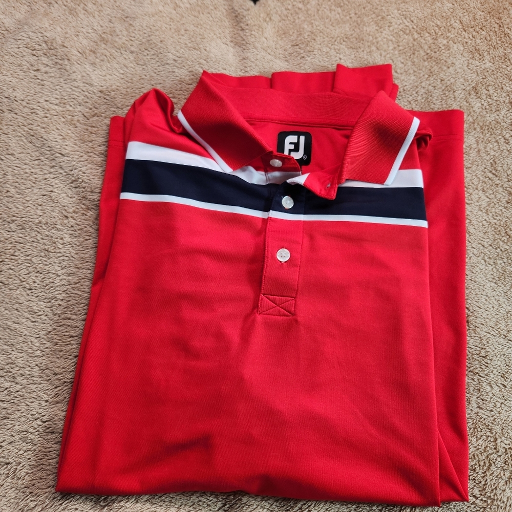 FootJoy Red Polo Shirt with White Stripes Dri-fit. There is a TPC On The Sleeve.